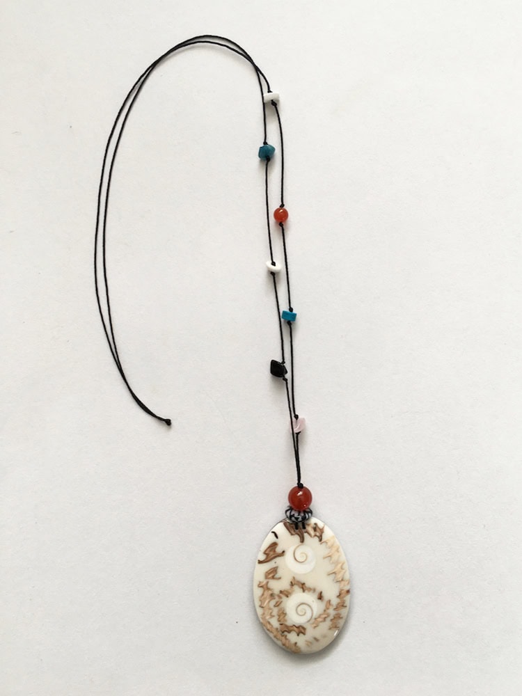 Long necklace with second hand shell pendants