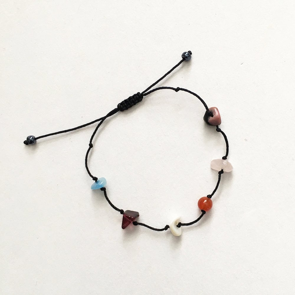 Adjustable bracelet with a mix of shell and vintage stone beads