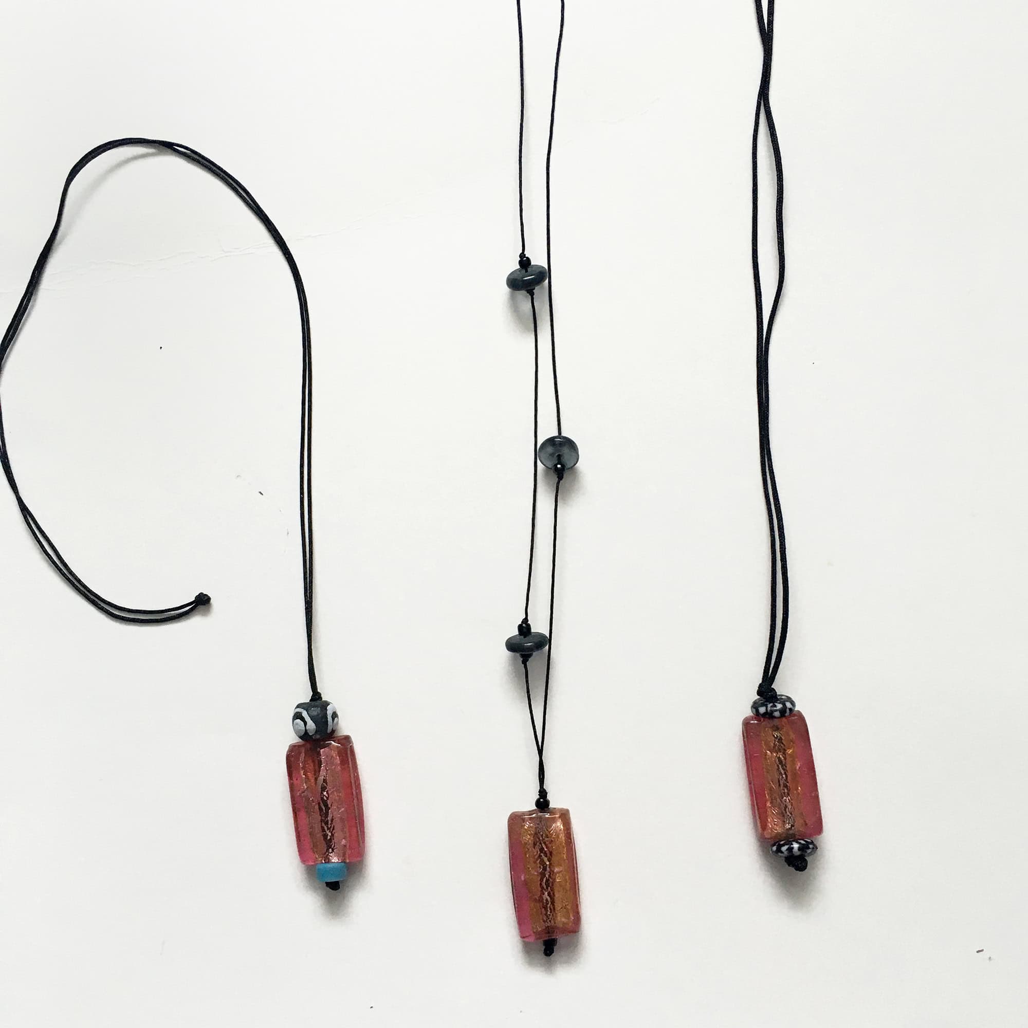Long necklaces with repurposed pendants, and recycled glass beads