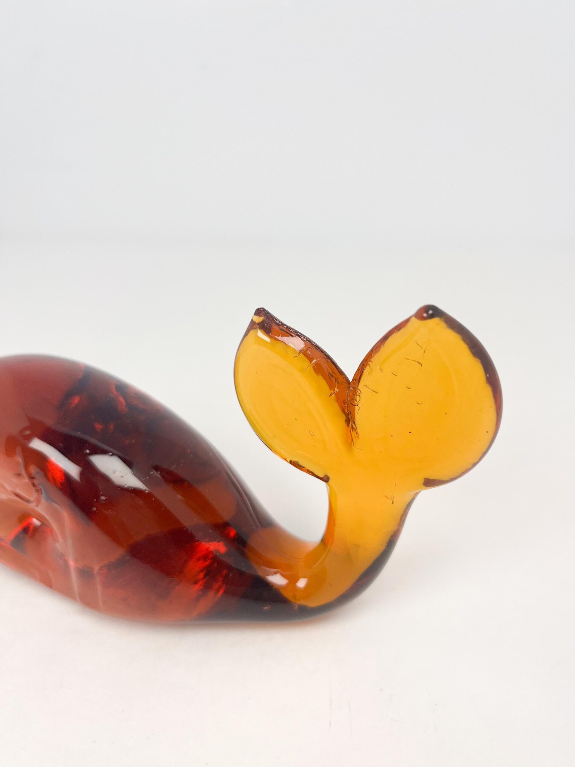 Vintage hand blown amber coloured glass whale paperweight