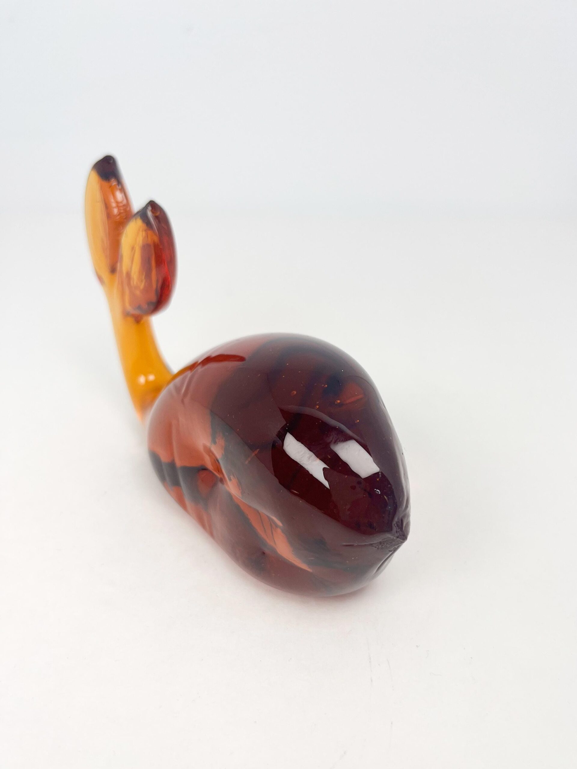 Vintage hand blown amber coloured glass whale paperweight