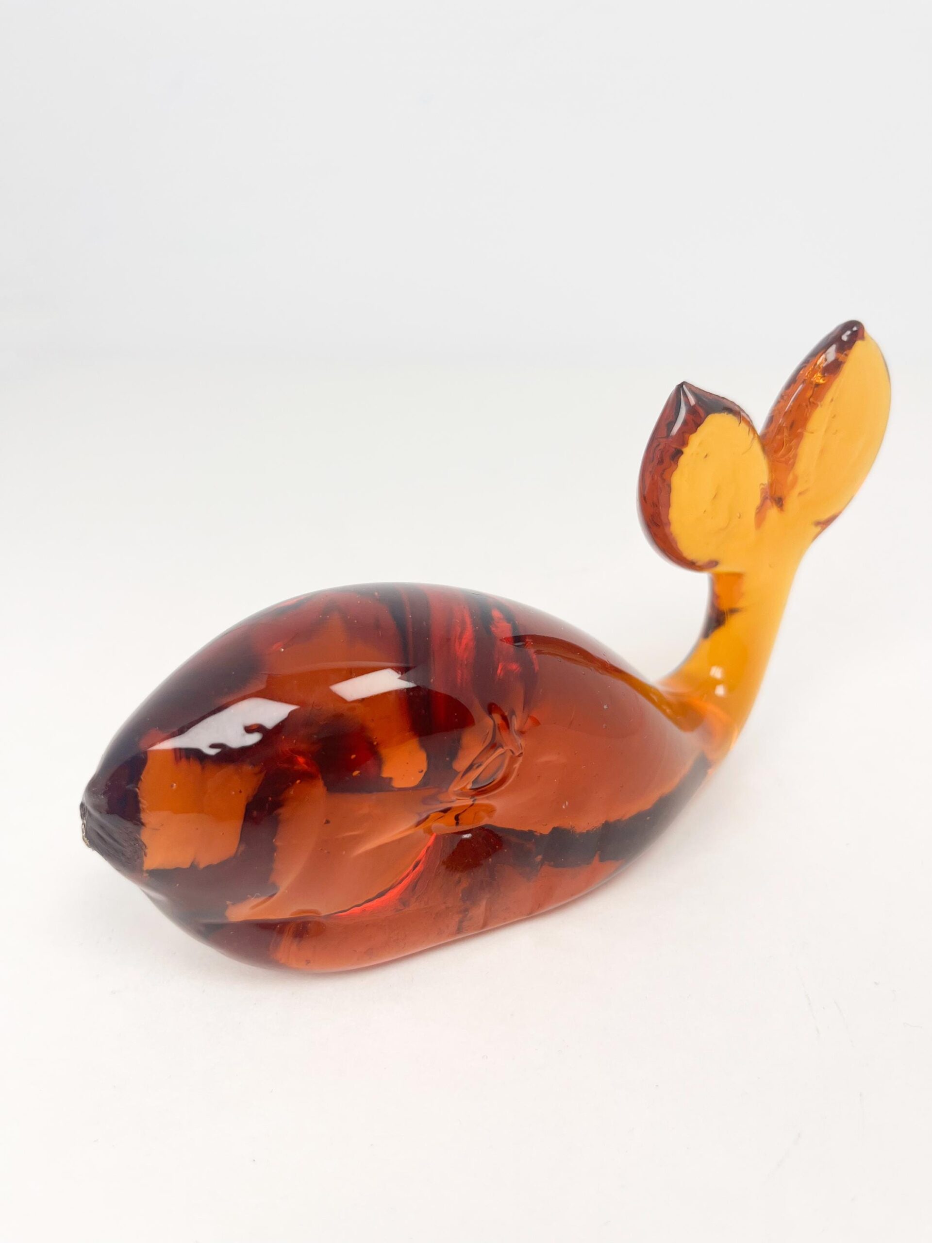 Vintage hand blown amber coloured glass whale paperweight
