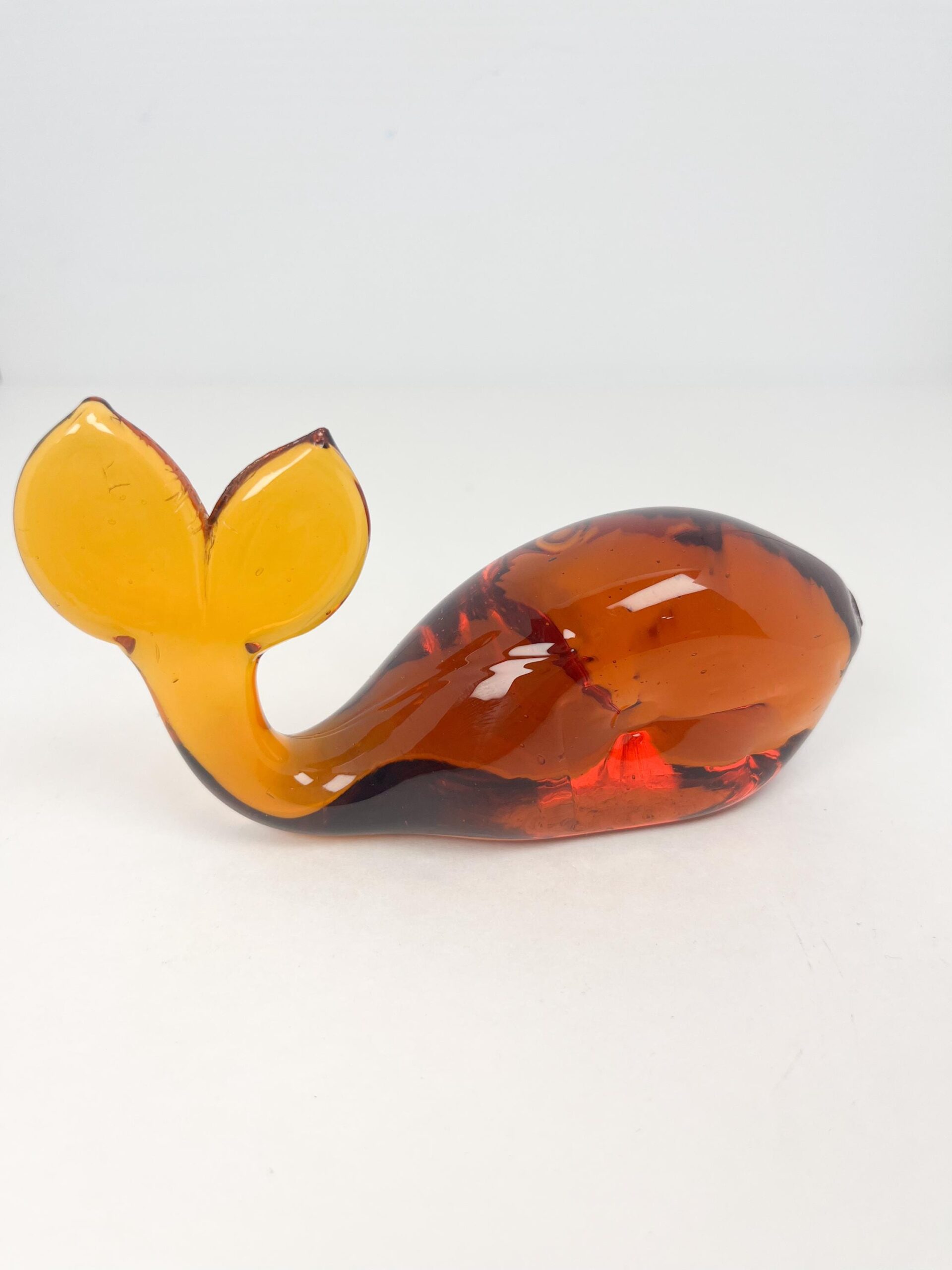 Vintage hand blown amber coloured glass whale paperweight