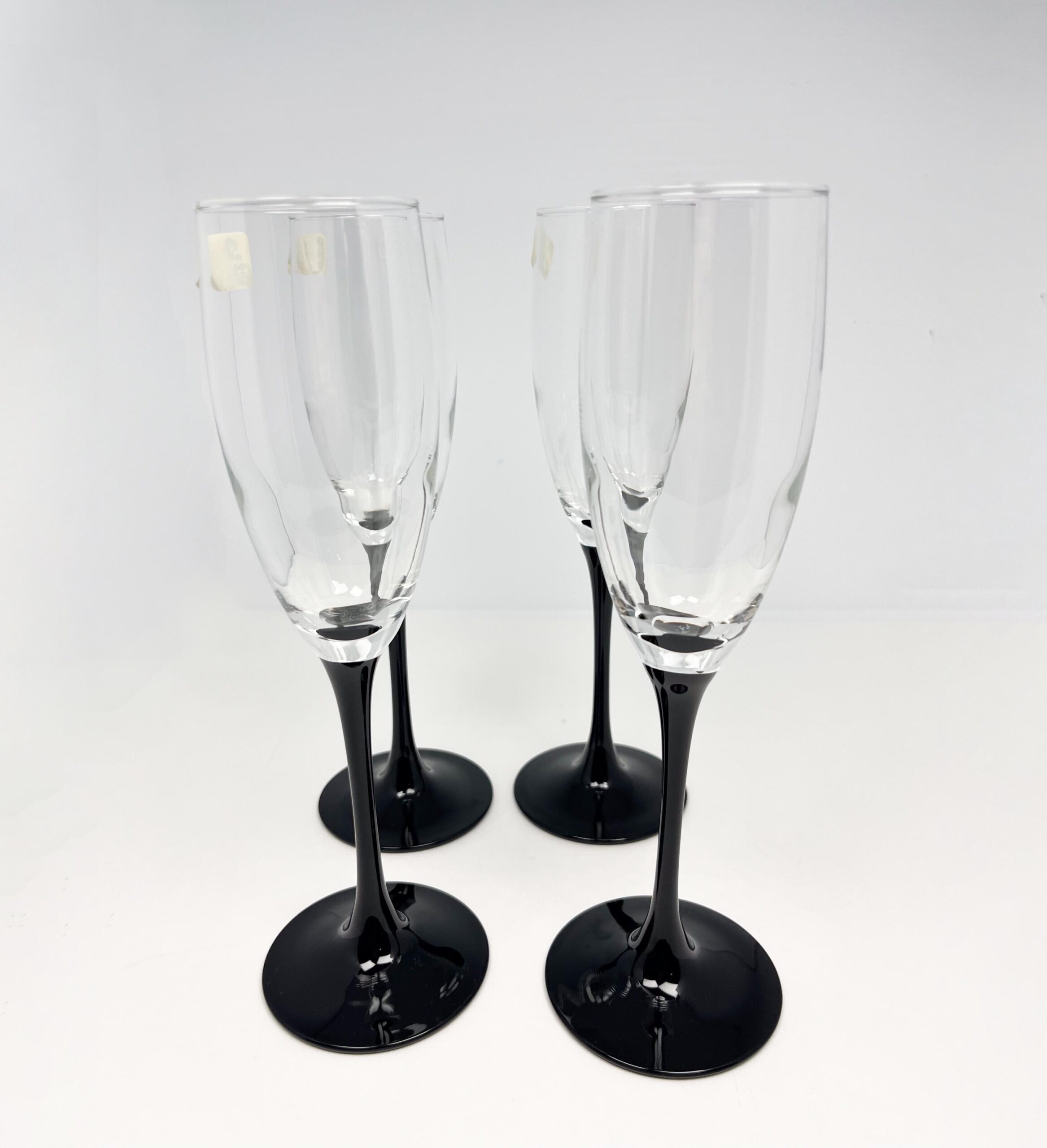 Set of 4 vintage black stem champagne flutes by Luminarc