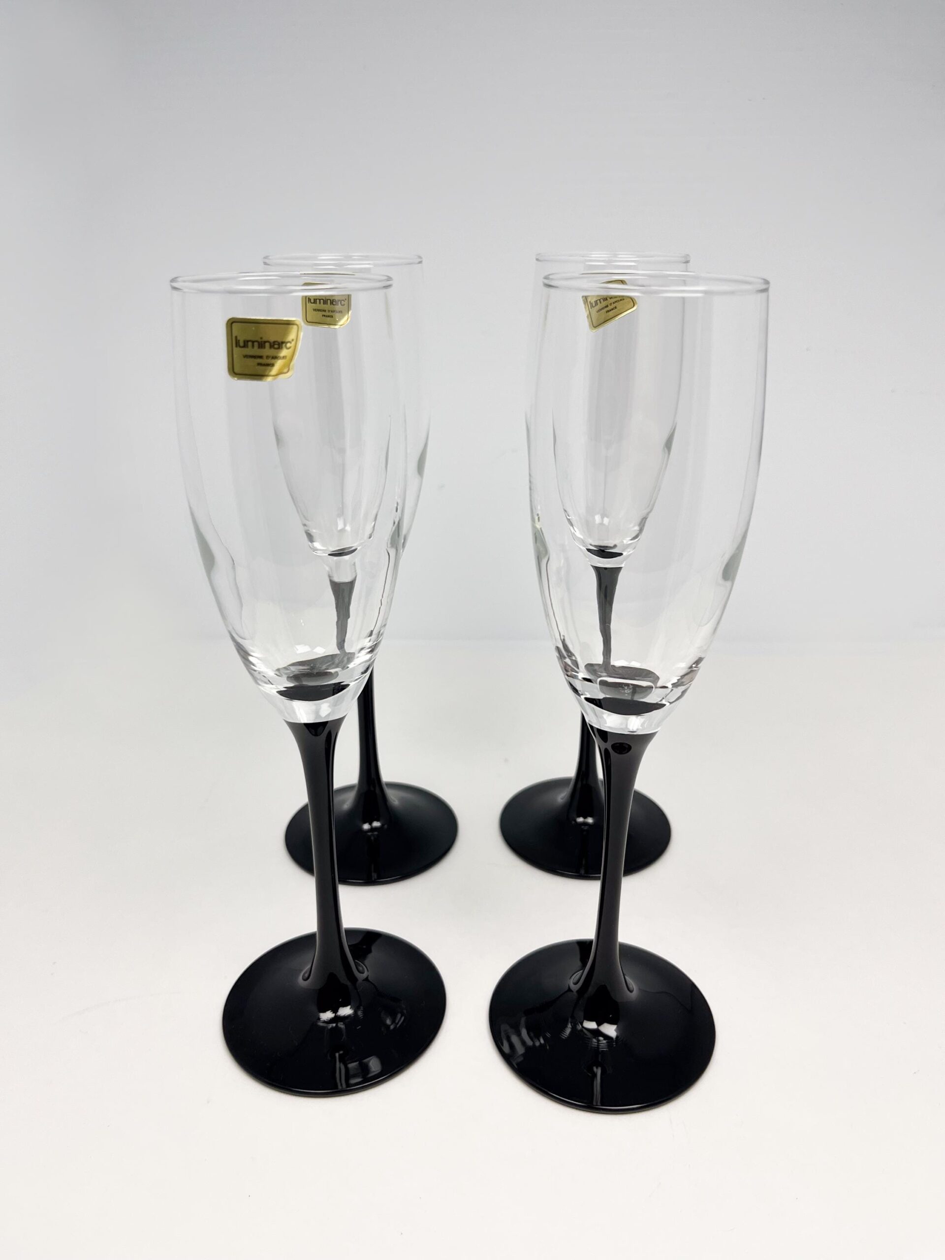 Set of 4 vintage black stem champagne flutes by Luminarc