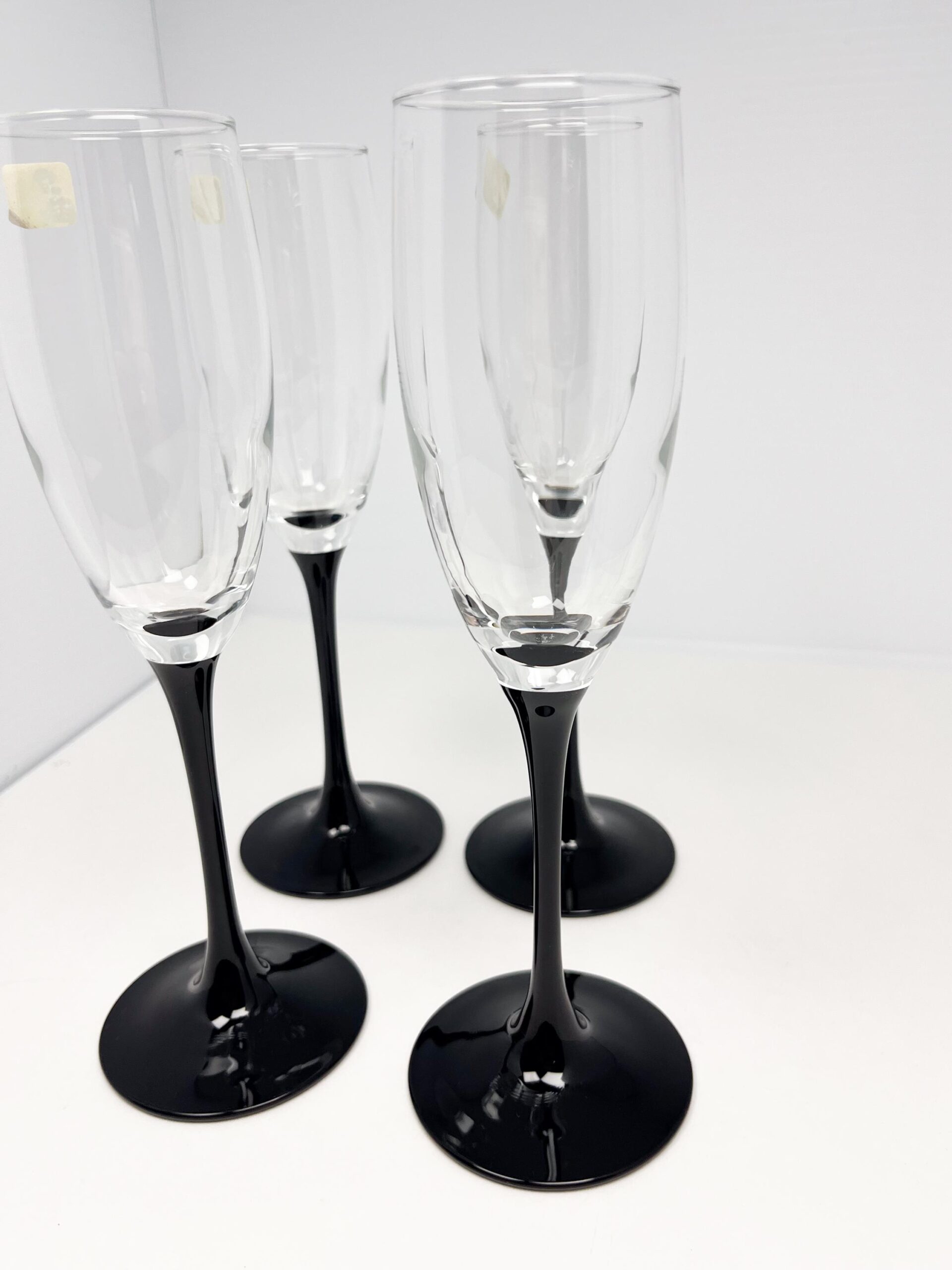 Set of 4 vintage black stem champagne flutes by Luminarc