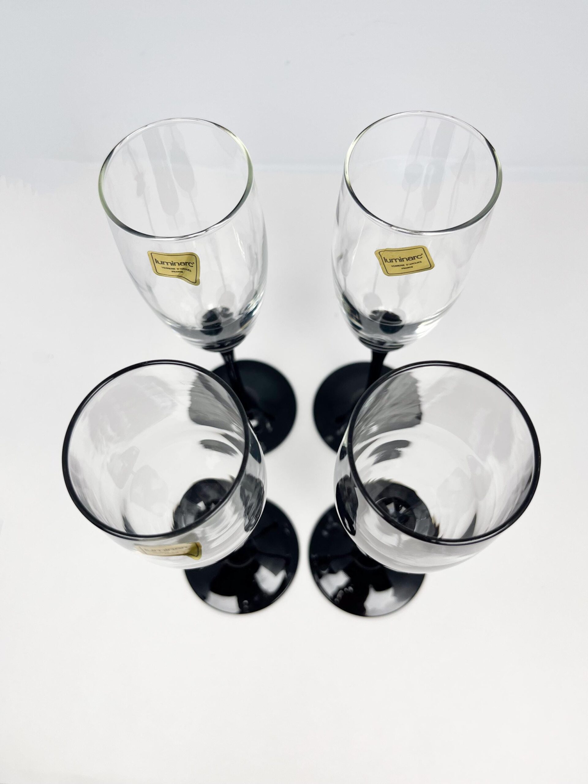 Set of 4 vintage black stem champagne flutes by Luminarc