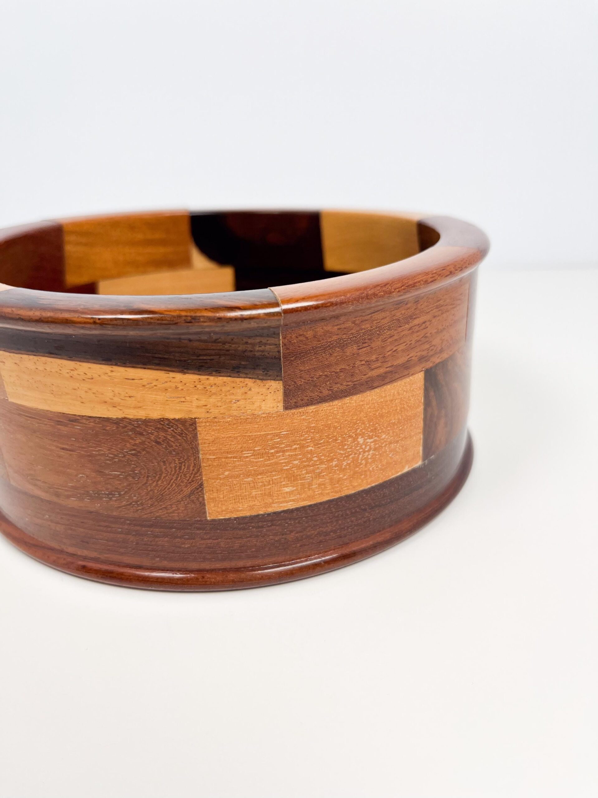 Decorative wood bowl with geometric mosaic panels