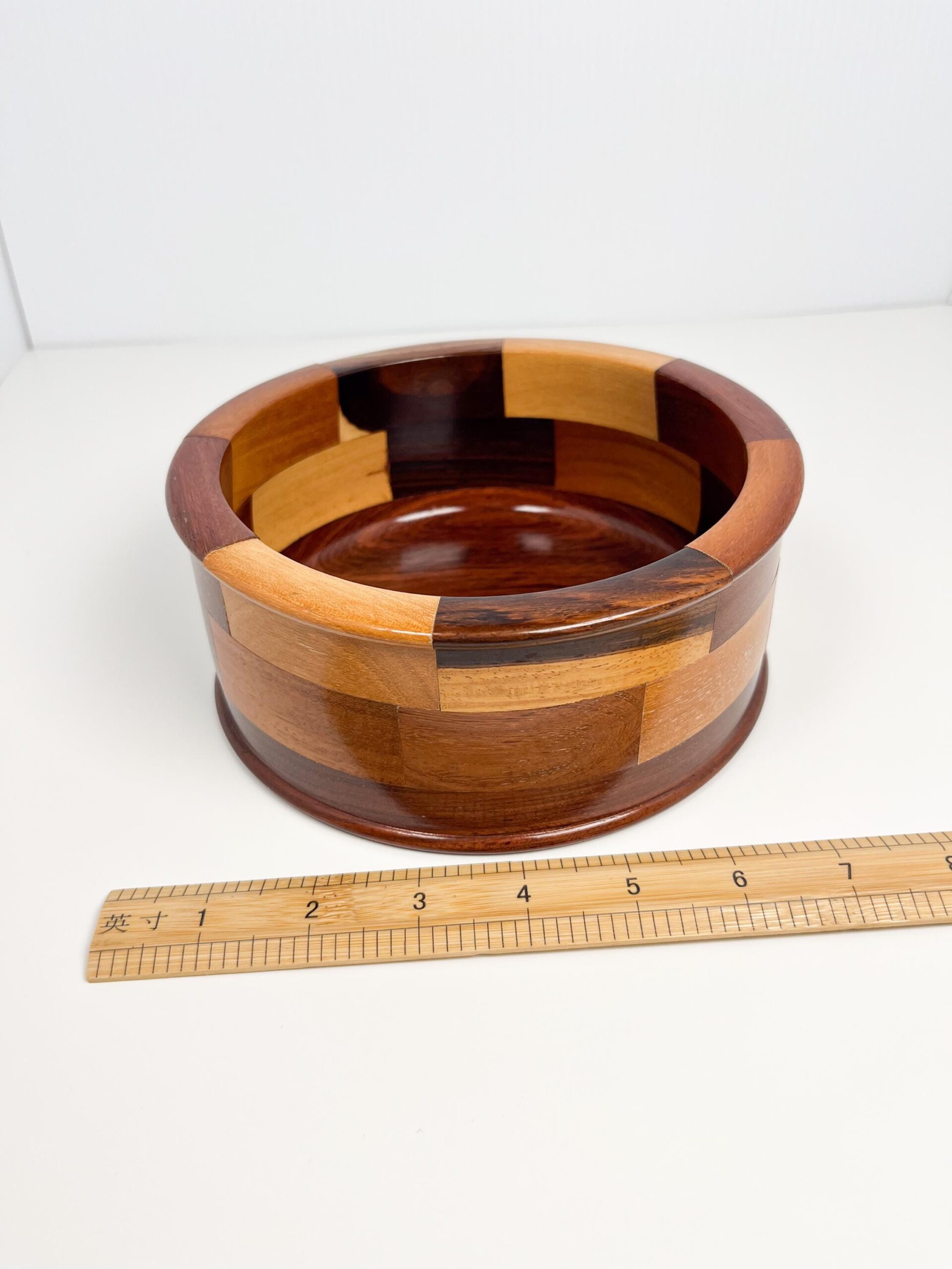 Decorative wood bowl with geometric mosaic panels