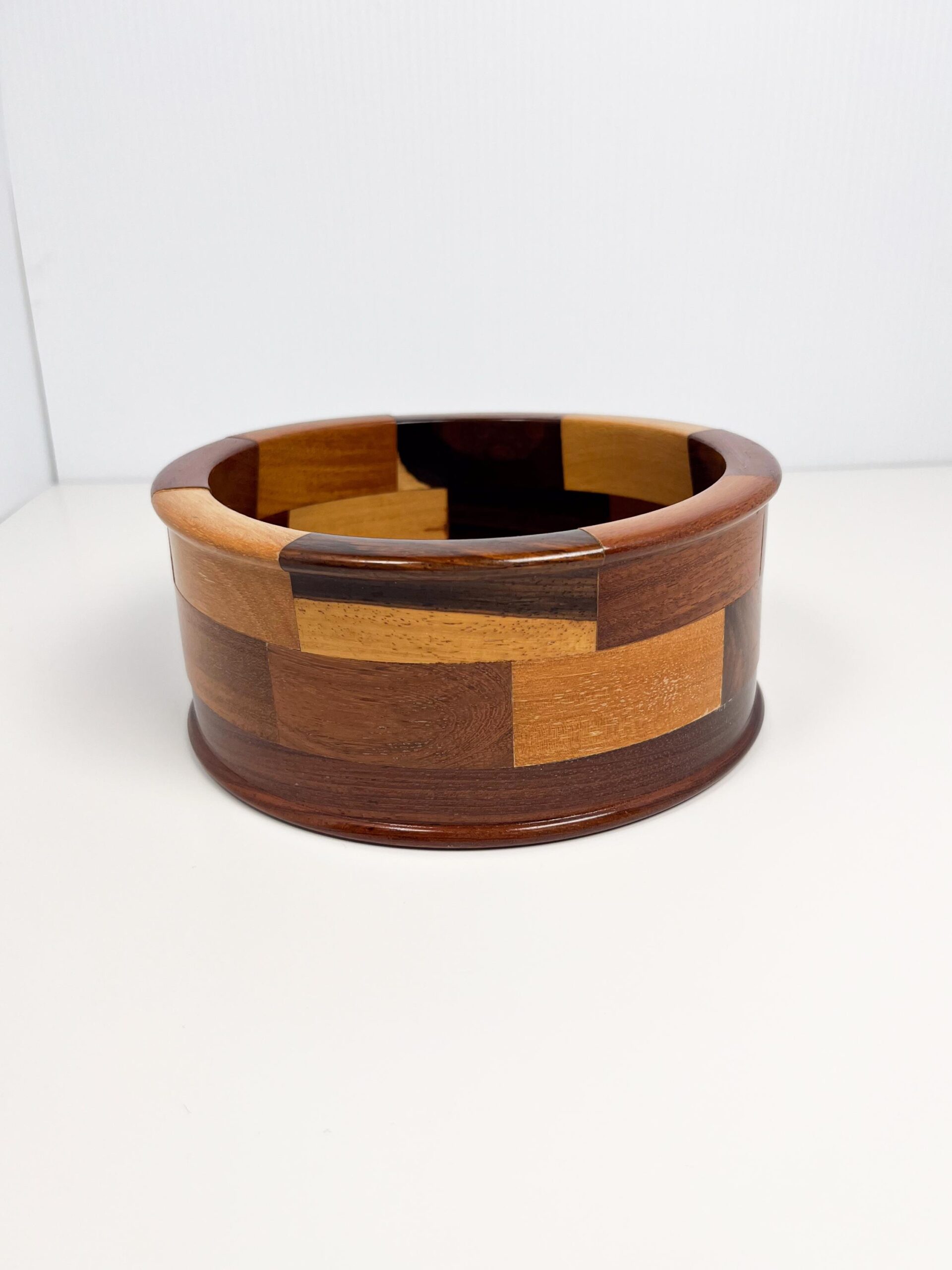 Decorative wood bowl with geometric mosaic panels