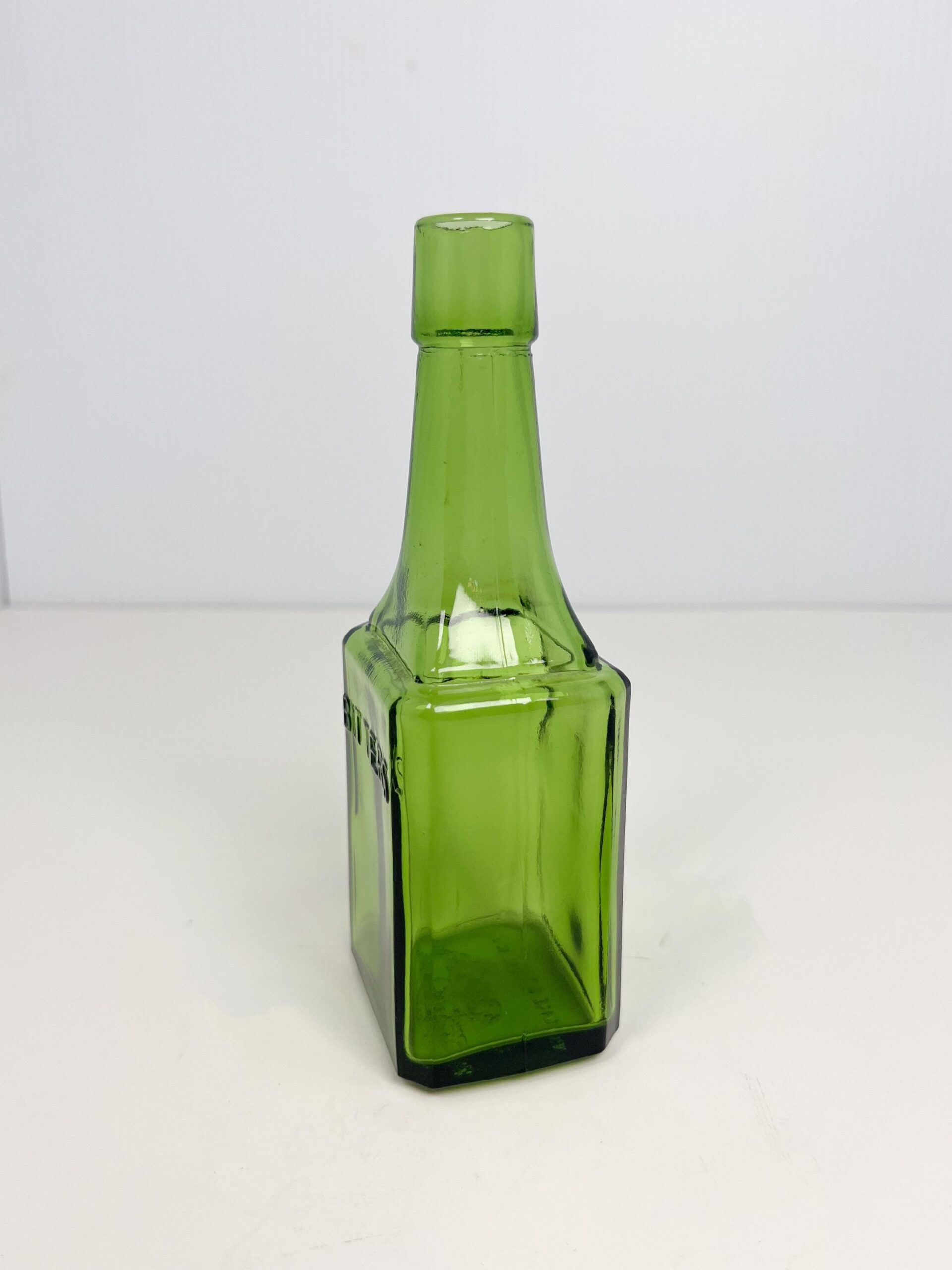 Vintage 6" Wheaton green glass bitters bottle - 60s reproduction