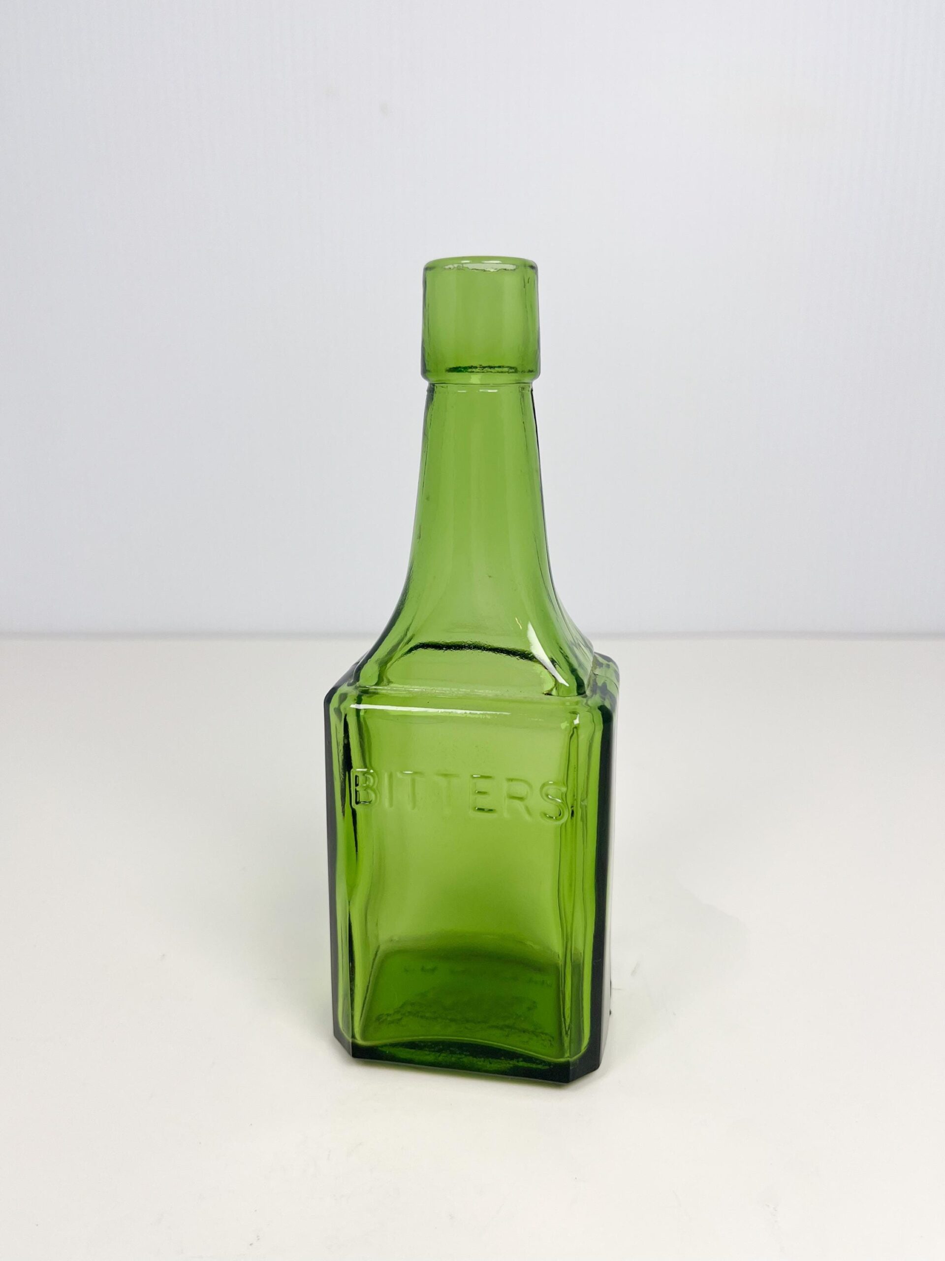 Vintage 6" Wheaton green glass bitters bottle - 60s reproduction