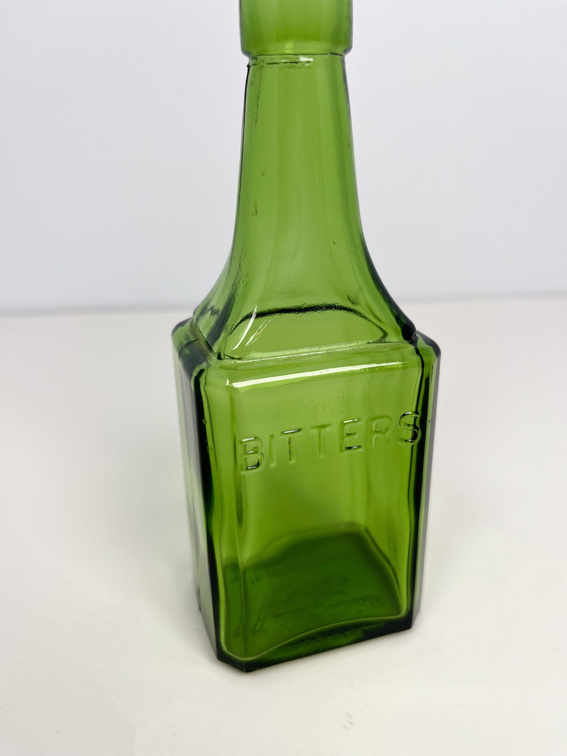 Vintage 6" Wheaton green glass bitters bottle - 60s reproduction