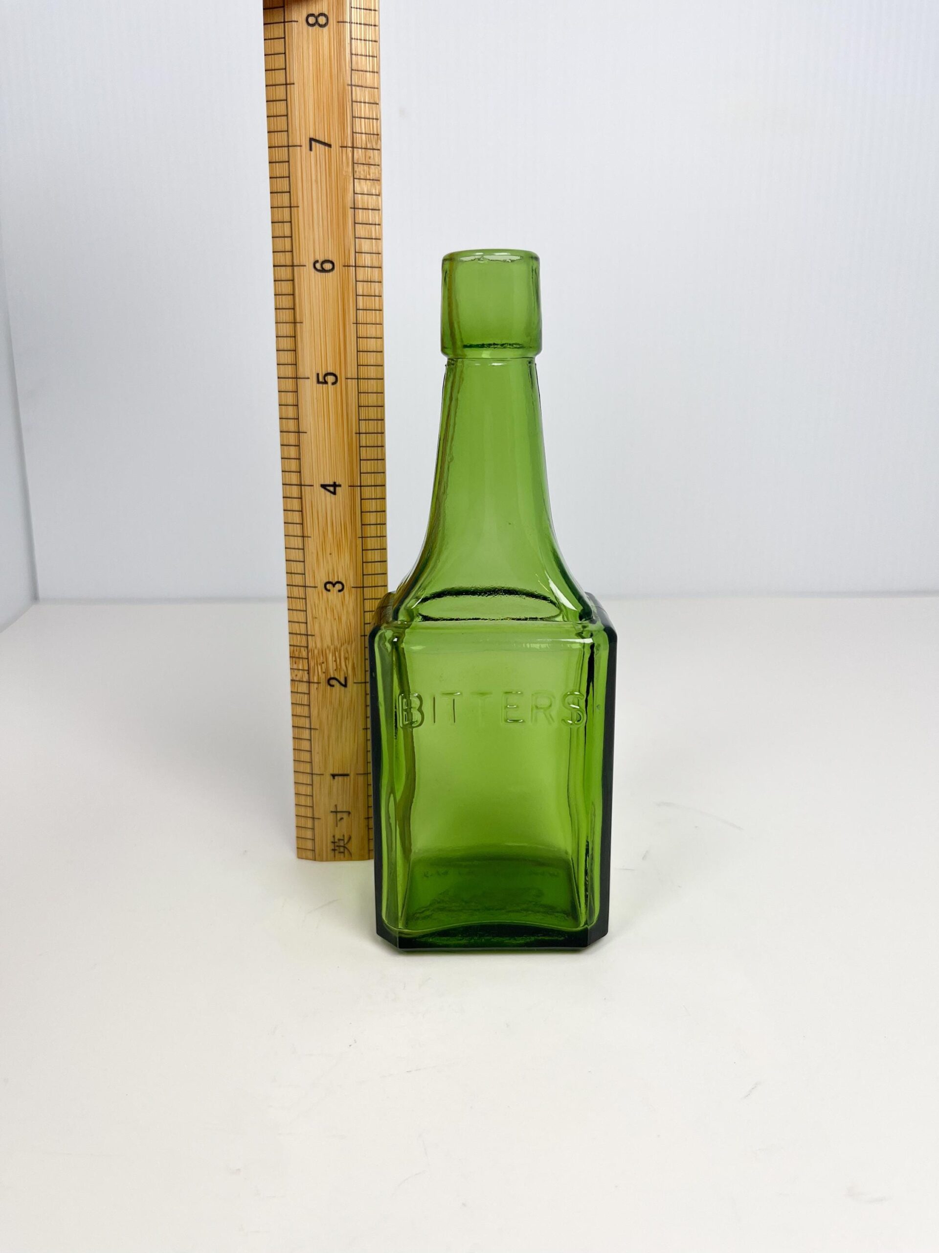 Vintage 6" Wheaton green glass bitters bottle - 60s reproduction