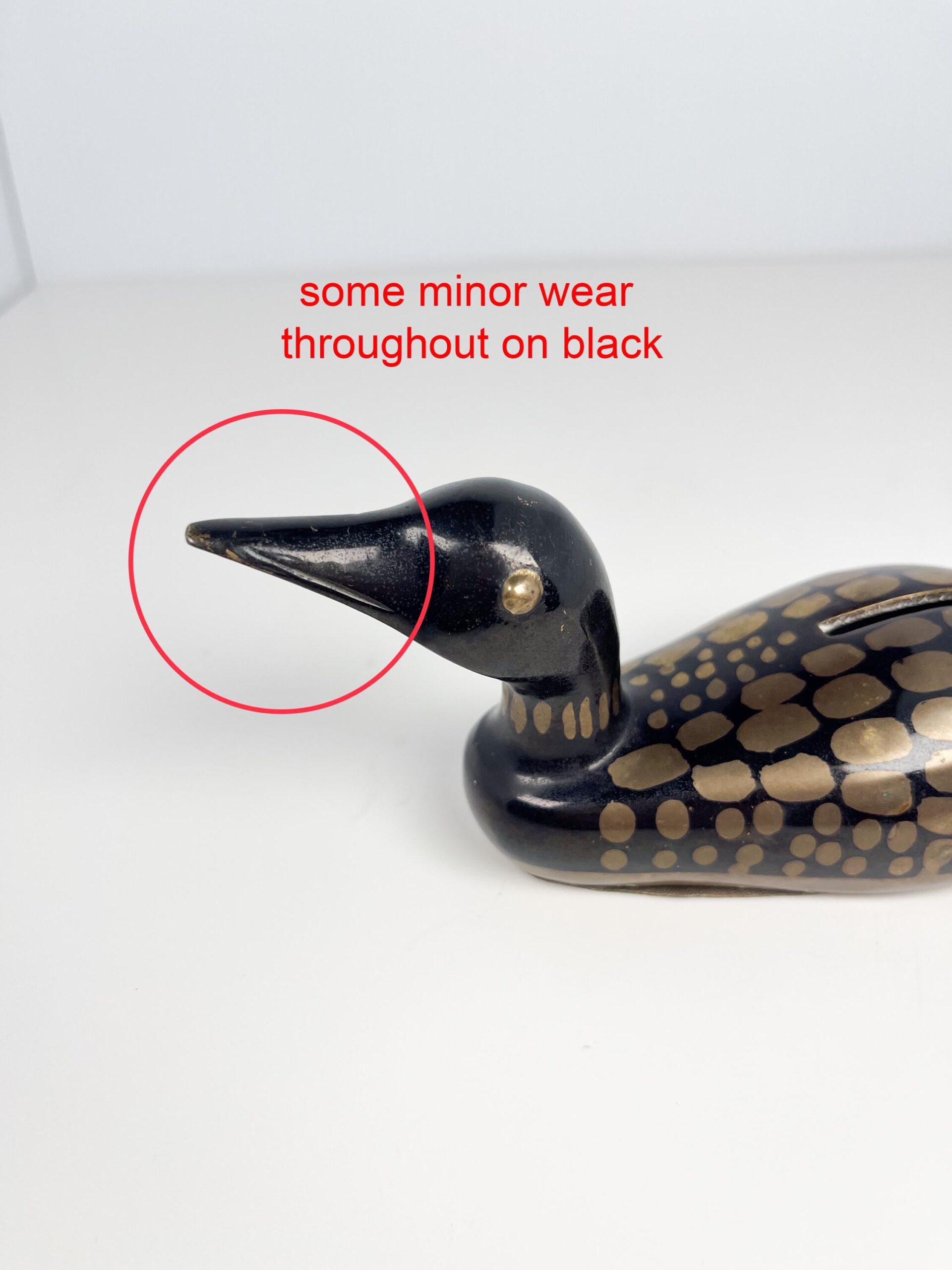 Small brass painted loon coin bank