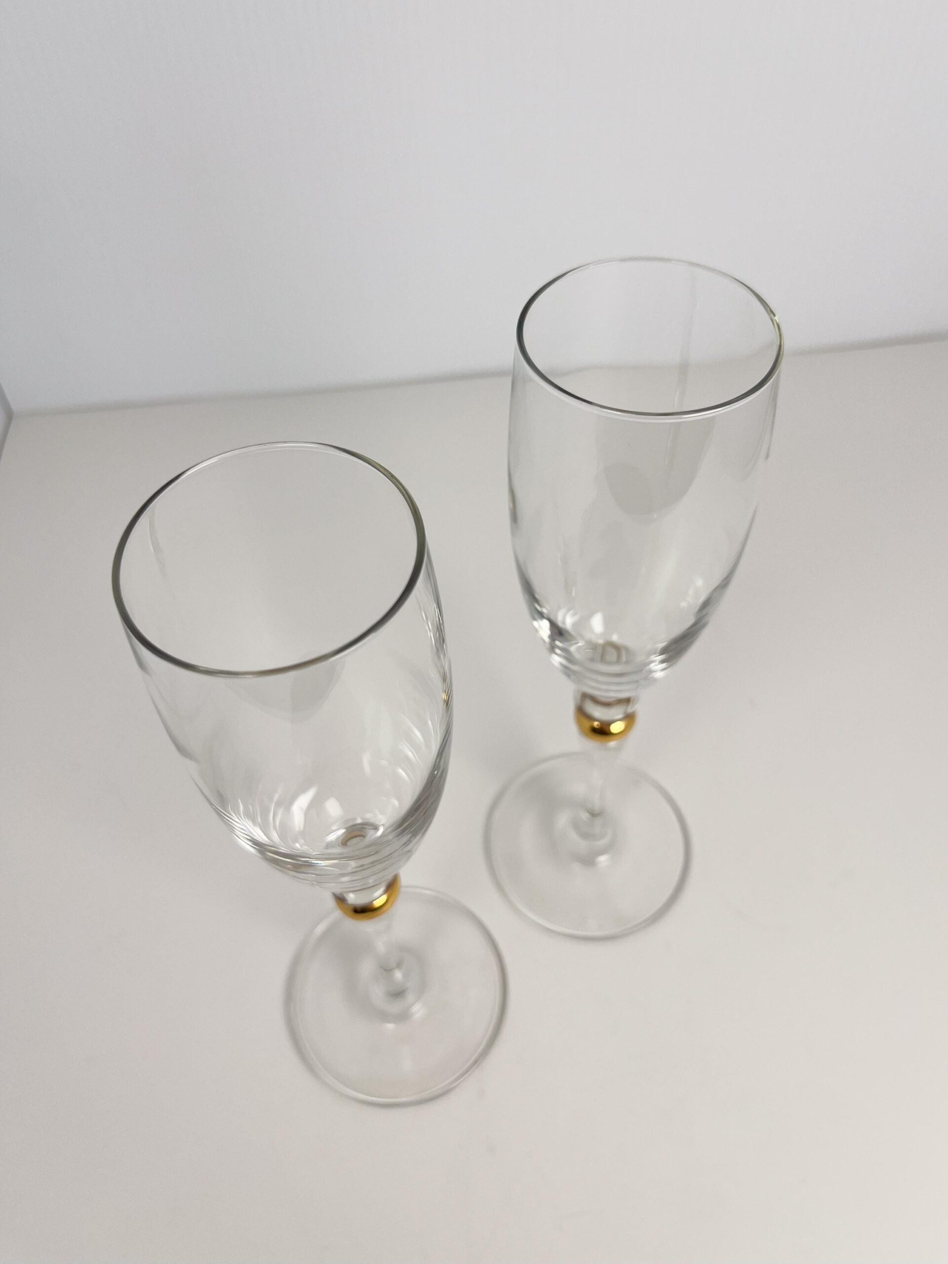 Set of 2 vintage crystal champagne flutes by Luminarc with gold decor on stem