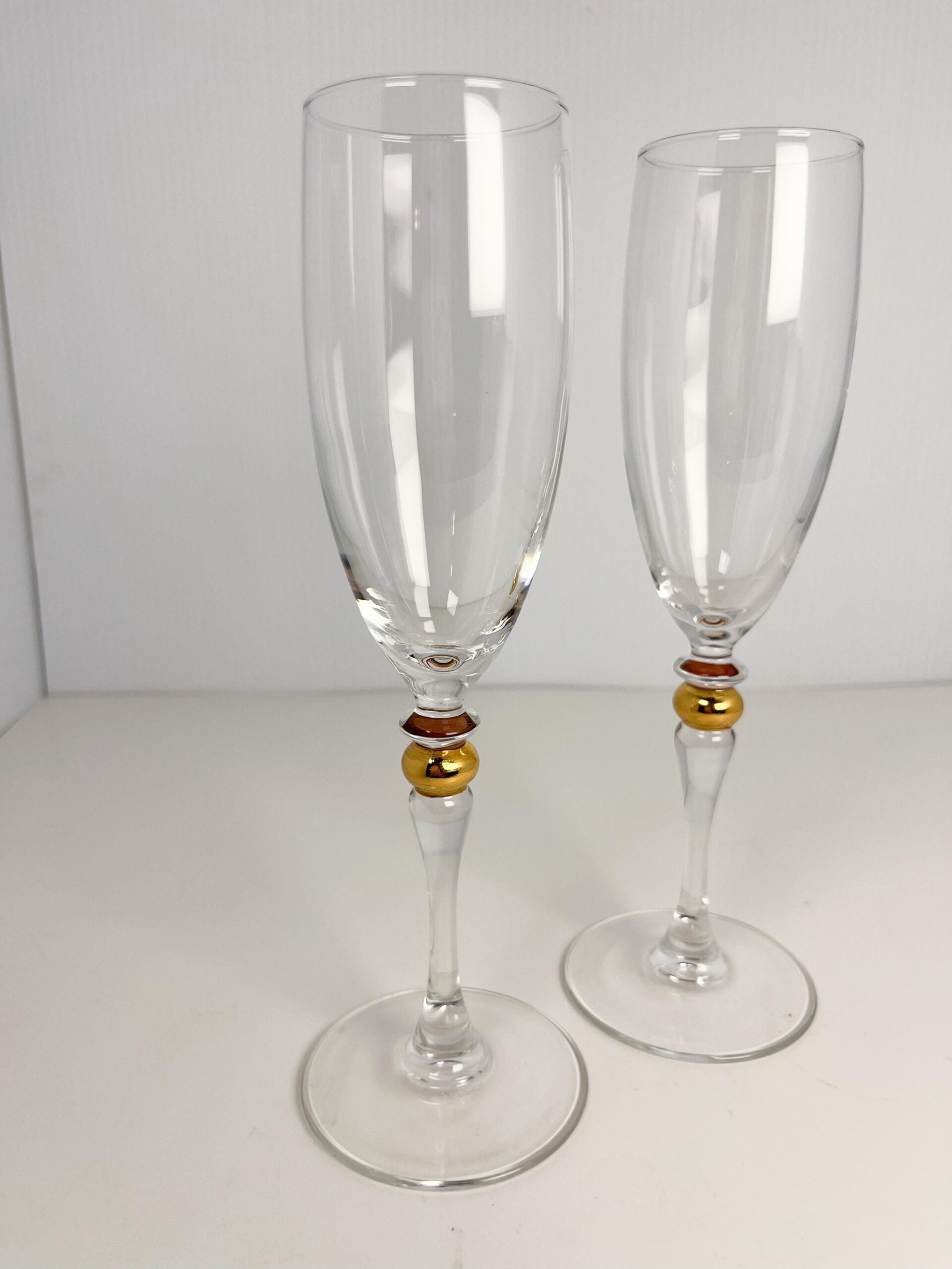 Set of 2 vintage crystal champagne flutes by Luminarc with gold decor on stem