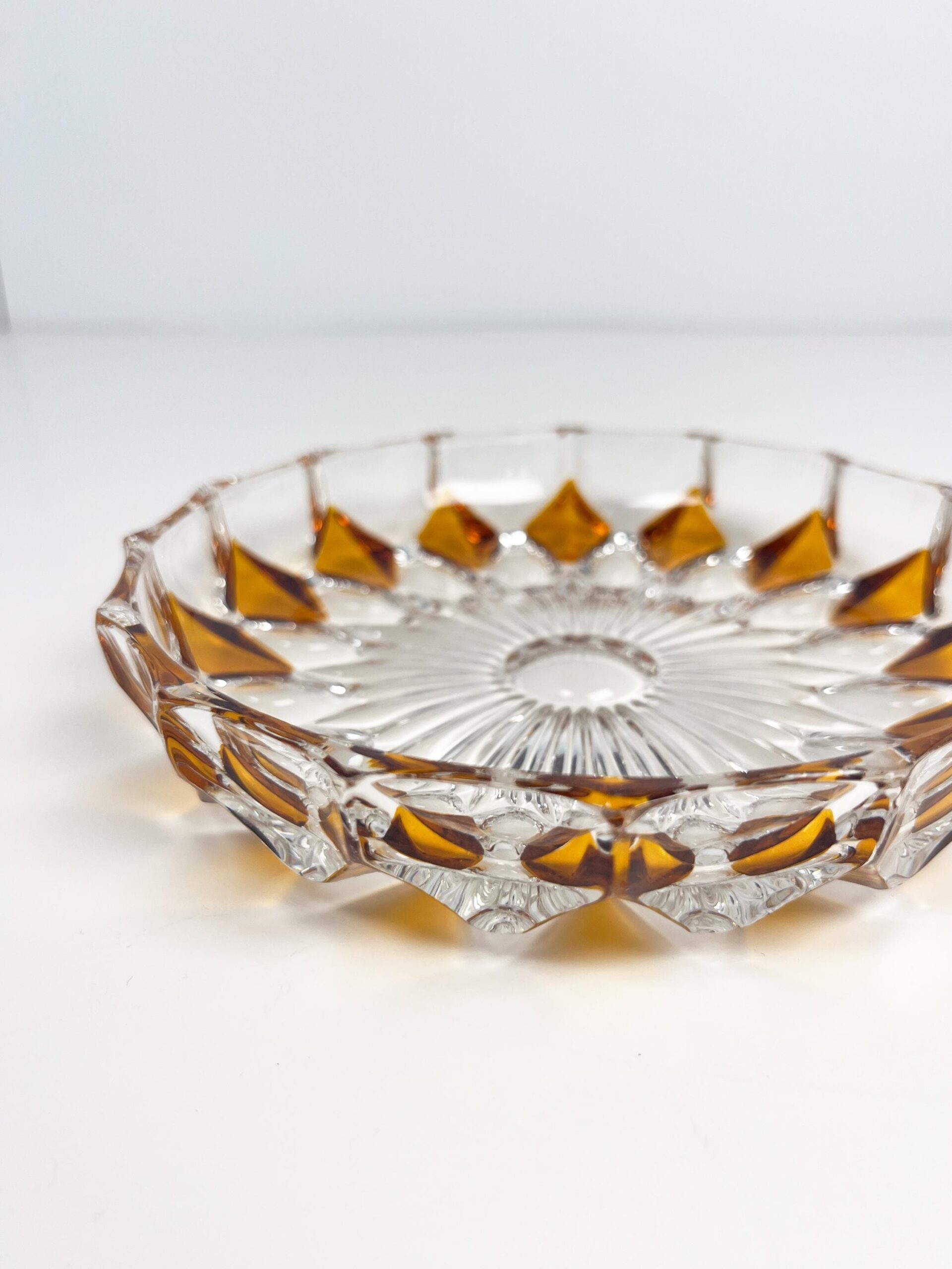 Vintage faceted crystal ashtray with amber coloured diamond motif