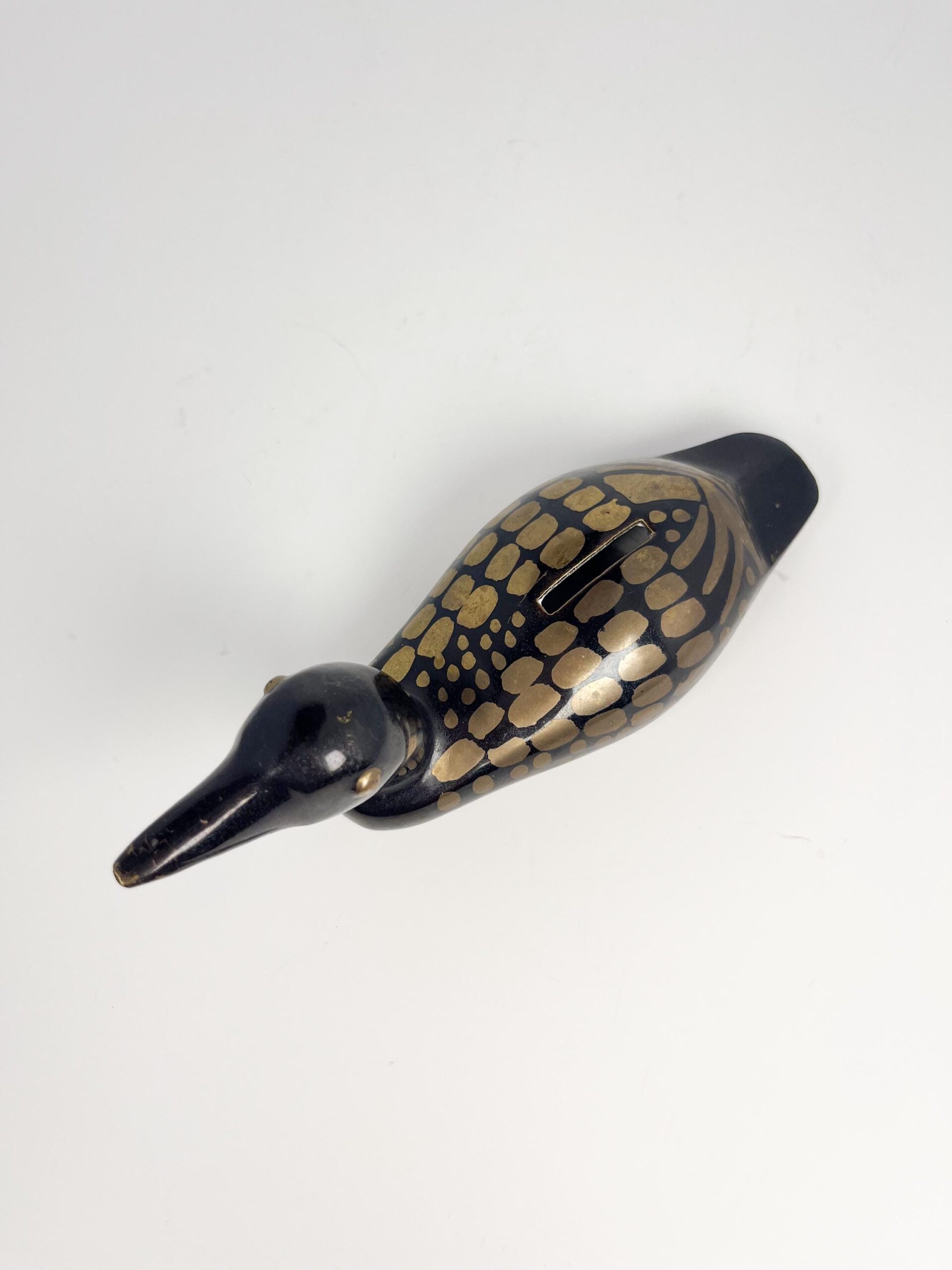 Small brass painted loon coin bank