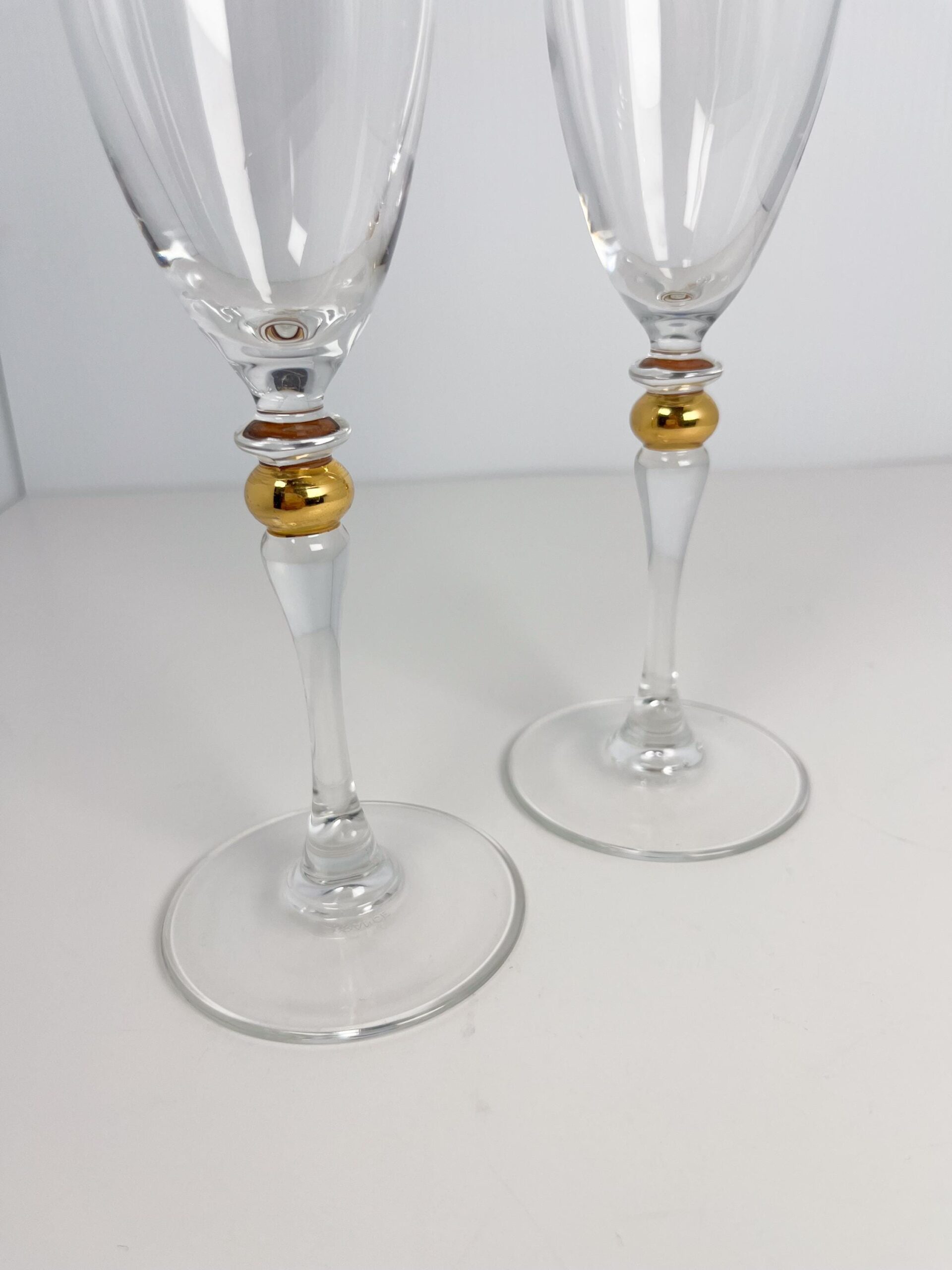 Set of 2 vintage crystal champagne flutes by Luminarc with gold decor on stem