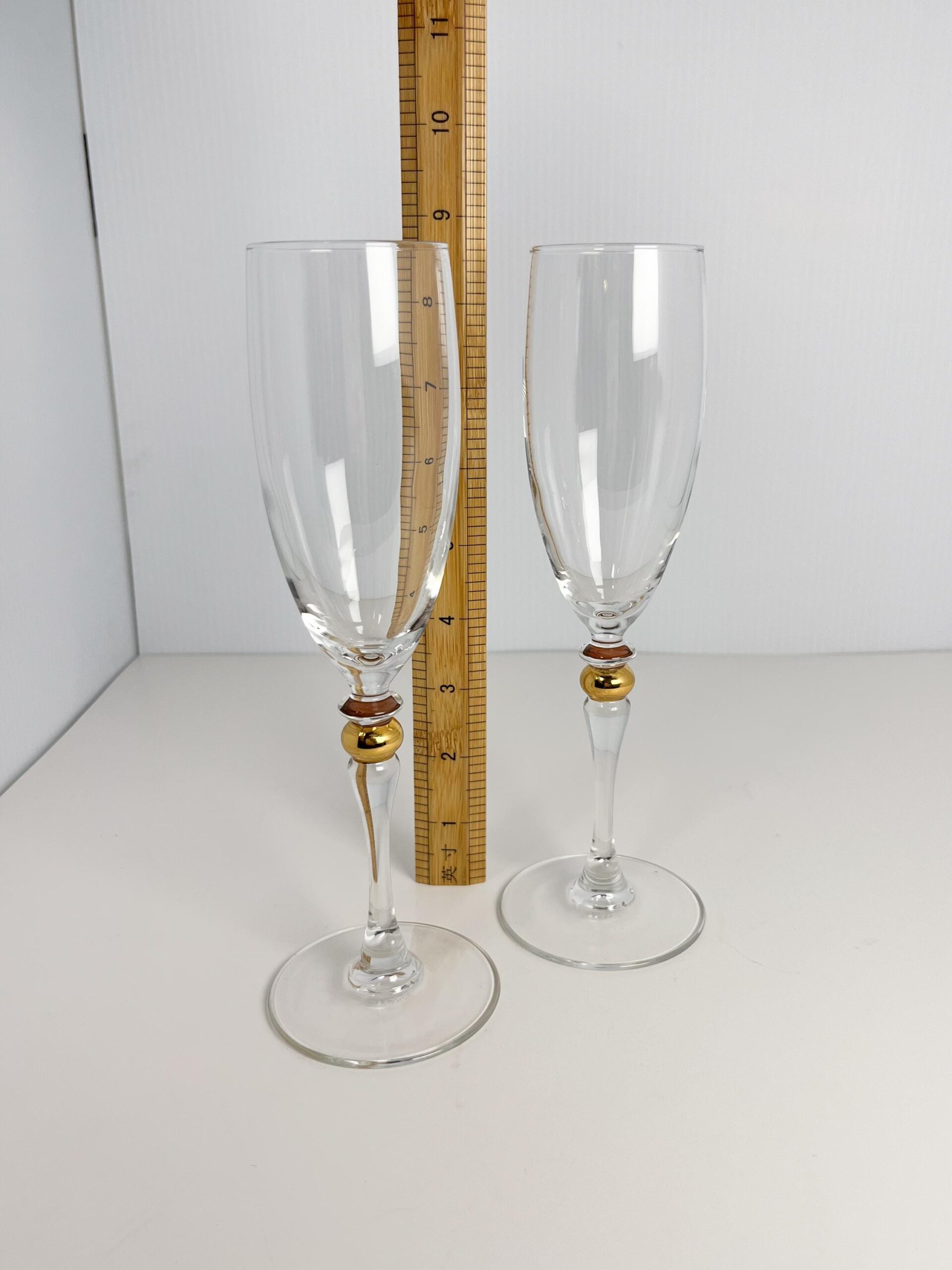 Set of 2 vintage crystal champagne flutes by Luminarc with gold decor on stem