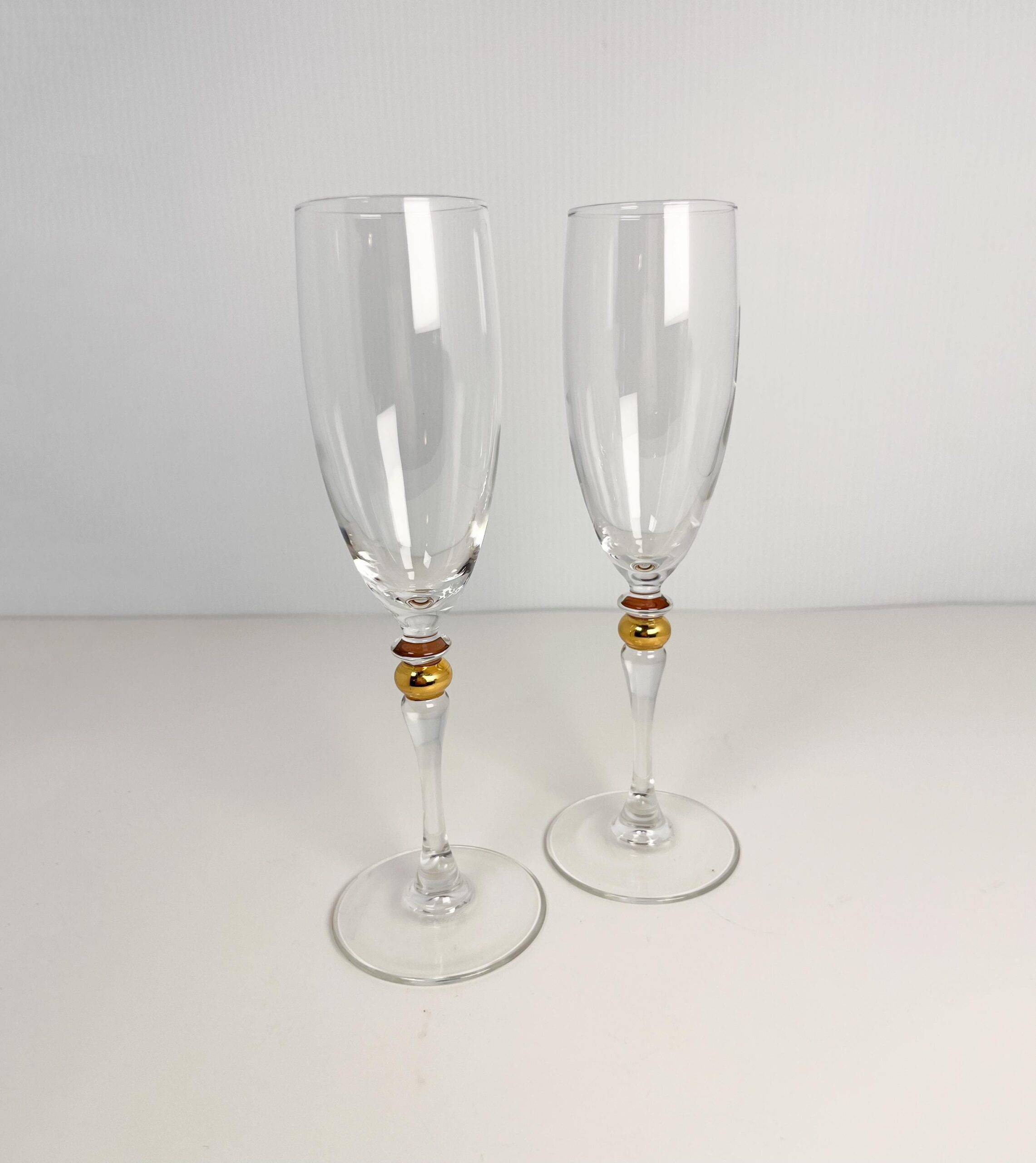 Set of 2 vintage crystal champagne flutes by Luminarc with gold decor on stem